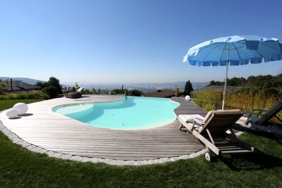 Pool with wooden surround in summer