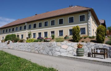 Rural residential building with throw stone wall